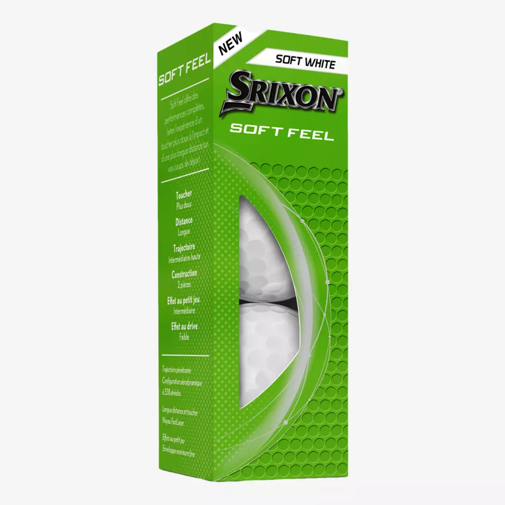 A green box of Srixon Soft Feel golf balls, labeled New and Soft White, with part of a golf ball visible through a transparent window—perfect for pairing with the best golf shoes 2026 for your next round.
