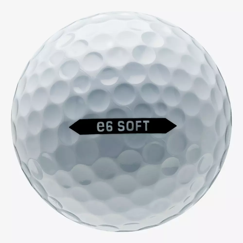 A close-up view of a white golf ball with numerous dimples and the text e6 SOFT printed in black on the surface, perfect for pairing with the best golf shoes 2026 for an enhanced game.