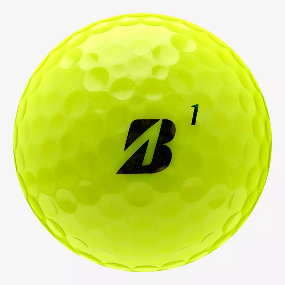 A bright yellow dimpled golf ball with a black B logo and the number 1 printed on it, shown on a plain white background—perfect for pairing with the best golf shoes 2026 for your next round.