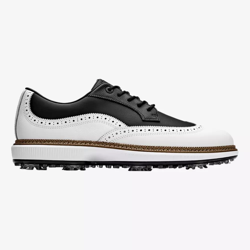 A black and white wingtip golf shoe with a leather upper, brogue detailing, black laces, and a spiked sole for grip. Inspired by the best Jordan golf shoes, the sole features tan trim for added style.
