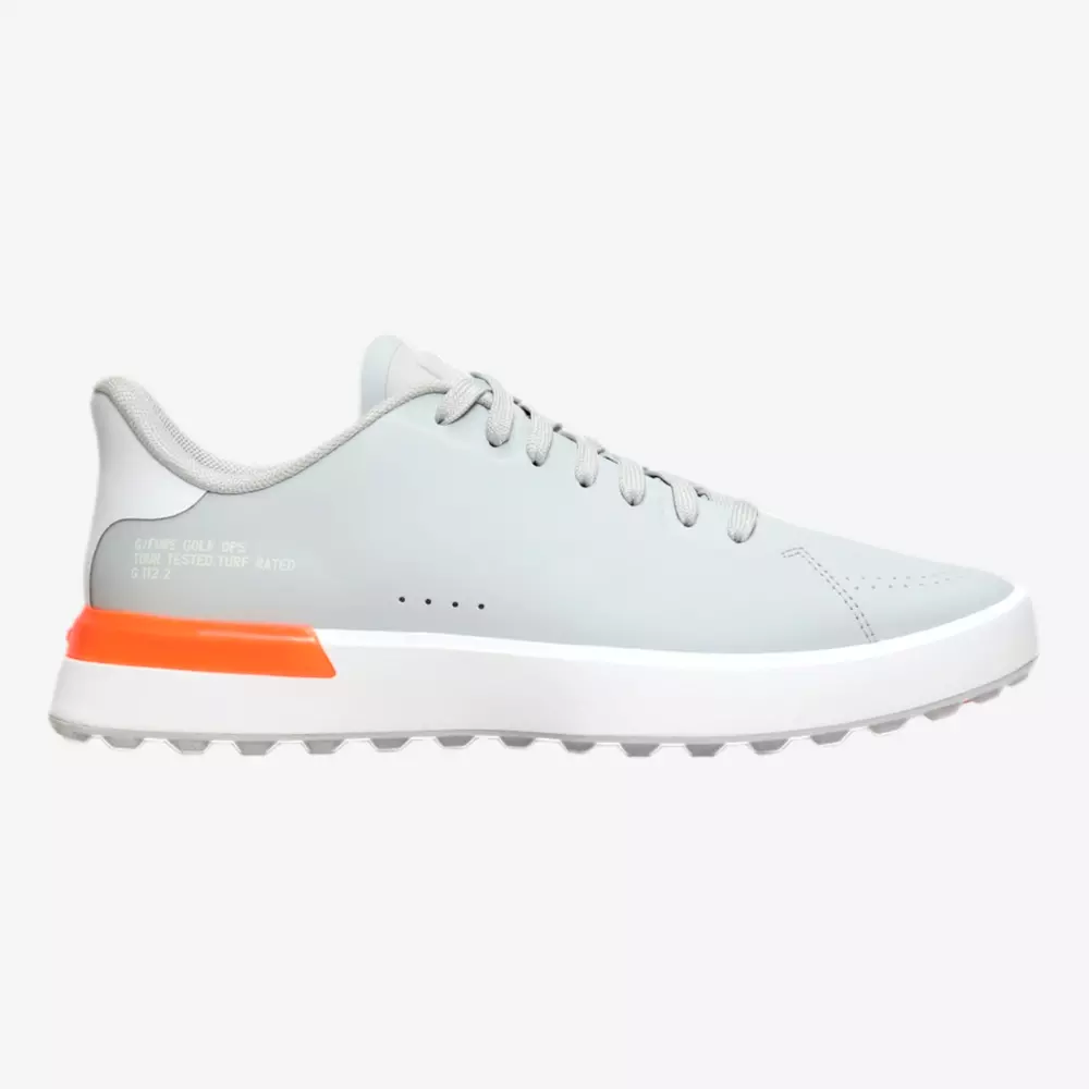 A light gray athletic sneaker with a white sole and an orange accent on the heel, featuring gray laces and a low-cut design—perfect for those seeking style inspired by the best Jordan golf shoes, displayed on a plain white background.