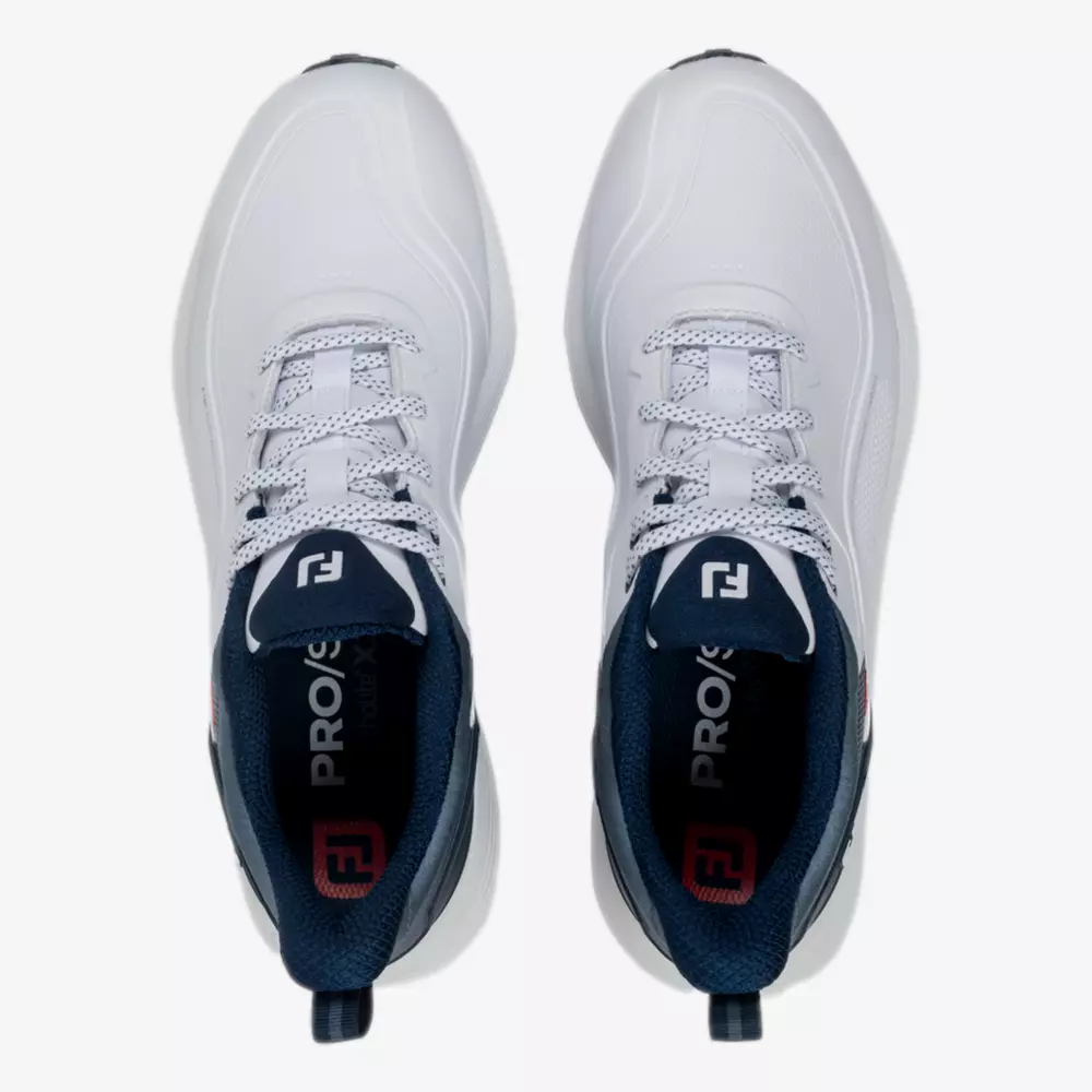 Top view of a pair of white athletic shoes with navy blue interiors, white laces, and a dark blue pull tab at the heel. The tongue features a navy label with a white and red logo, inspired by the best Jordan golf shoes.