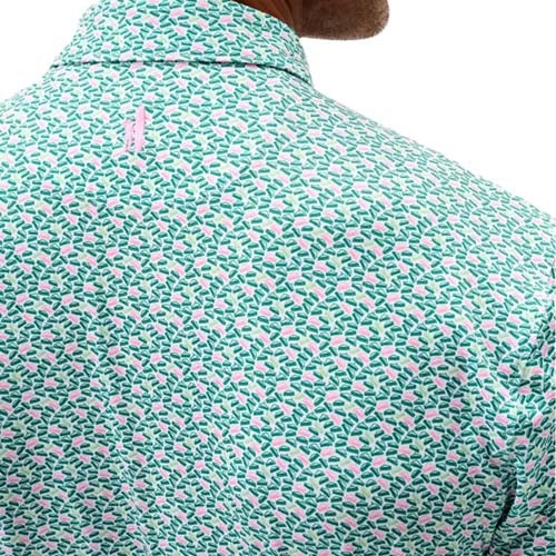 Close-up of the back of a man's shirt with a colorful, small leaf pattern in shades of green, white, and pink—one of the best looks from The First Major. The collar and upper back highlight the detailed fabric design.