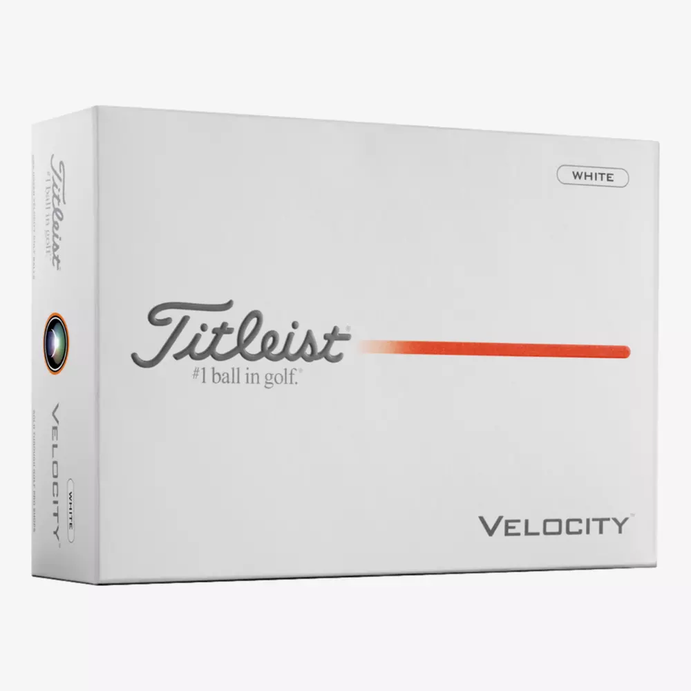 A white box of Titleist Velocity golf balls with the Titleist logo, an orange line, and the words #1 ball in golf and VELOCITY on the front—perfect for pairing with the best golf shoes 2026. A small WHITE label appears in the upper right corner.