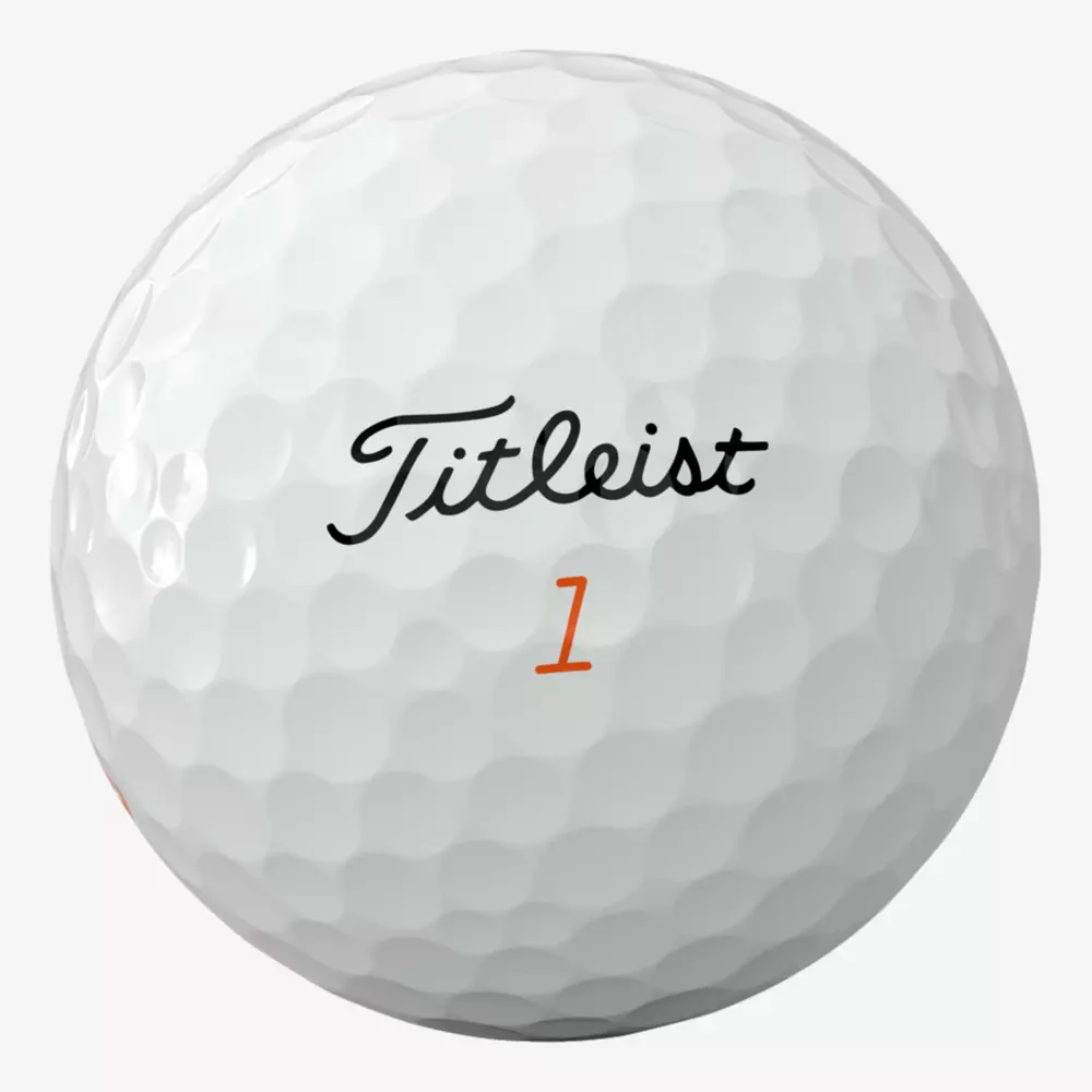 A white golf ball with dimples, featuring the black Titleist logo and an orange number 1 printed below it—a perfect match for those searching for the best golf shoes 2026 to elevate their game.