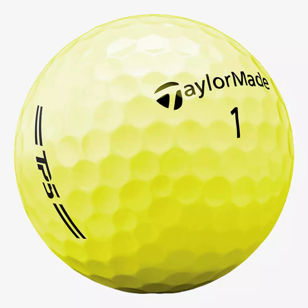 A yellow TaylorMade golf ball with the number 1, TPS branding, and black text and markings on its dimpled surface—perfect for pairing with the best golf shoes 2026 for an upgraded game.