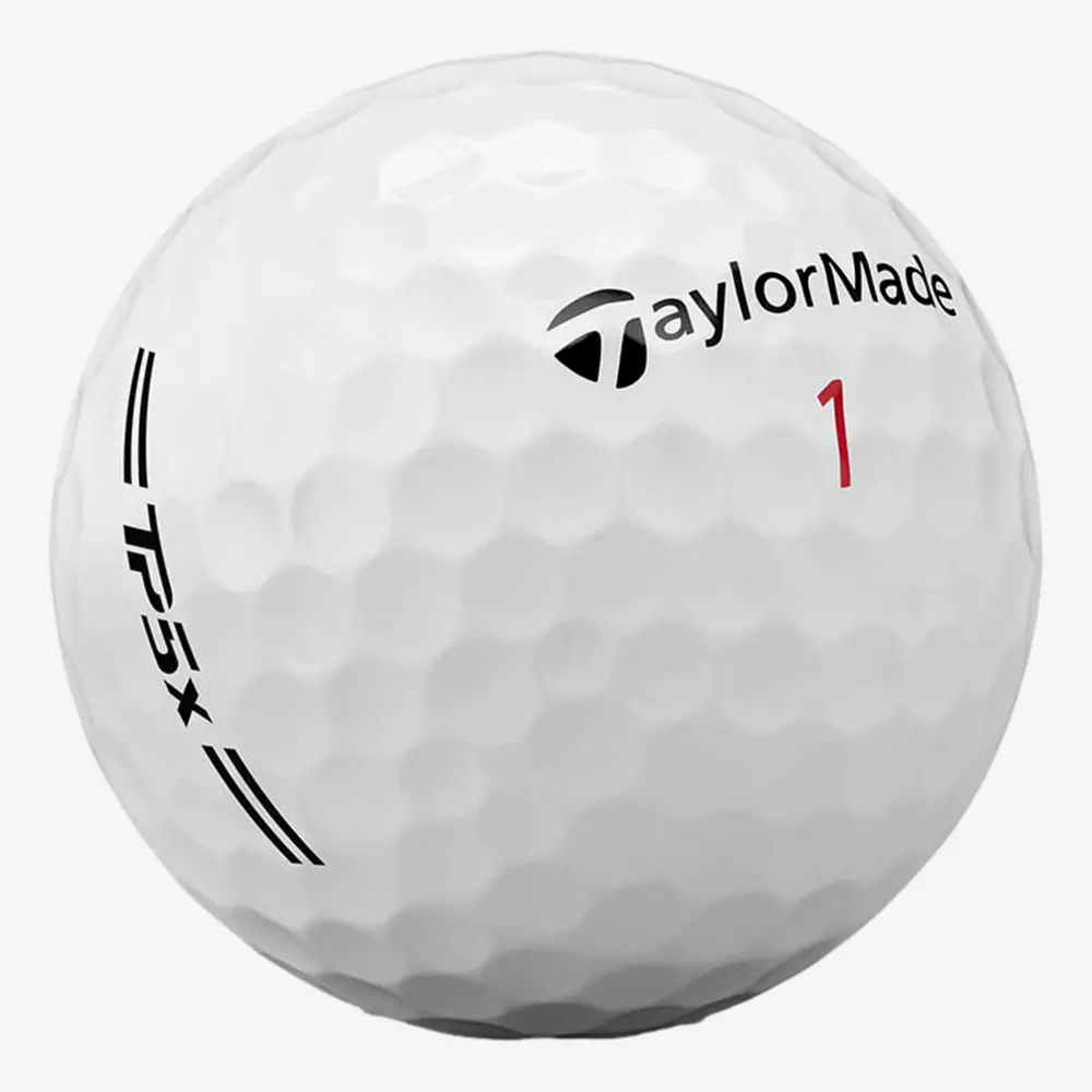 A close-up of a white TaylorMade golf ball with the brand logo, the word TP5x, and the number 1 printed in red. The textured dimples are clearly visible—perfect for pairing with the best golf shoes 2026 on your next round.