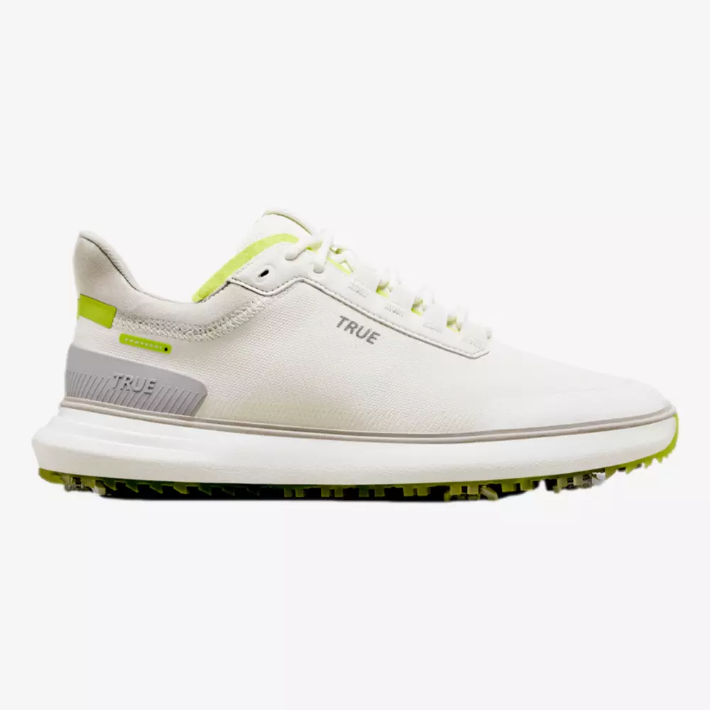 A white athletic sneaker with neon green accents, gray details, and the word TRUE on the side. Inspired by the best Jordan golf shoes, it features a textured sole perfect for sports or outdoor activities.