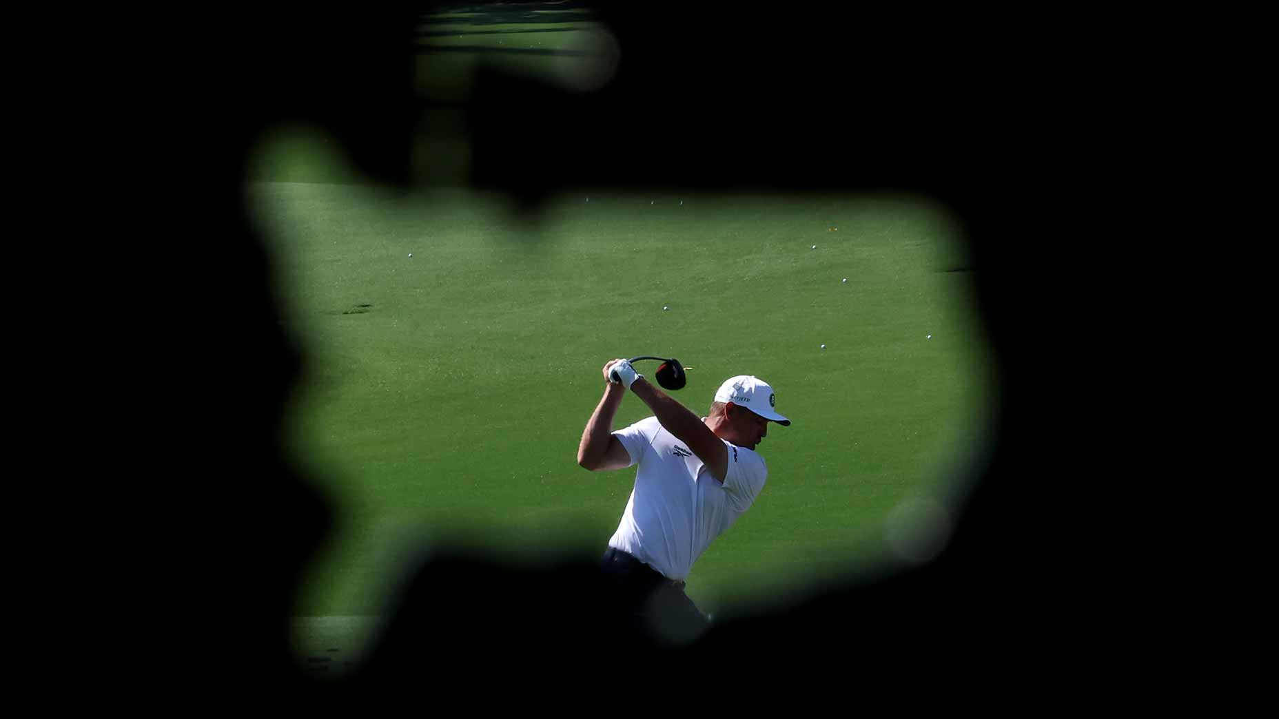 2026 Masters field: Bryson DeChambeau pictured on Augusta National range through sign.