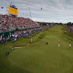 Royal Lytham & St. Annes' 18th hole seen during 2012 Open Championship, with Adam Scott crouched on green.
