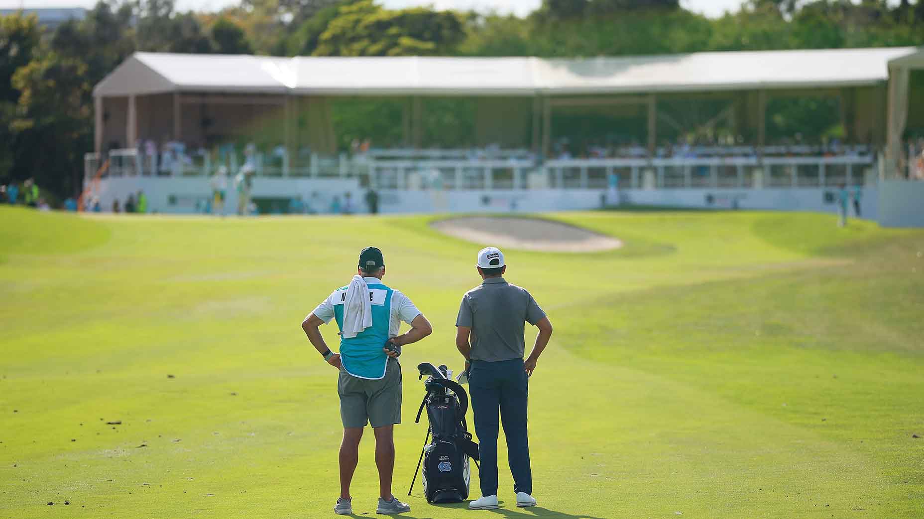 Korn Ferry Tour golfer Dylan Menante and his caddie.