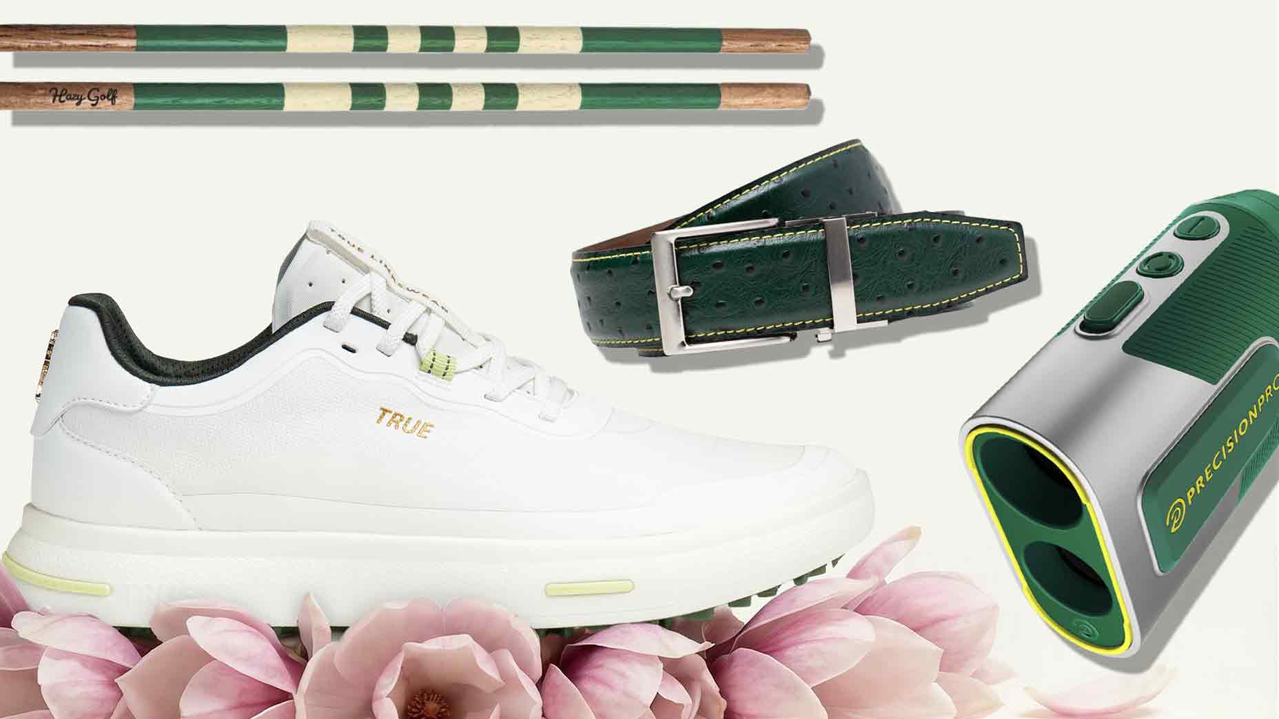 A white sneaker, a green leather belt, a golf rangefinder, and two green-and-tan tees are arranged among pink lotus flowers—an elegant nod to the Masters.