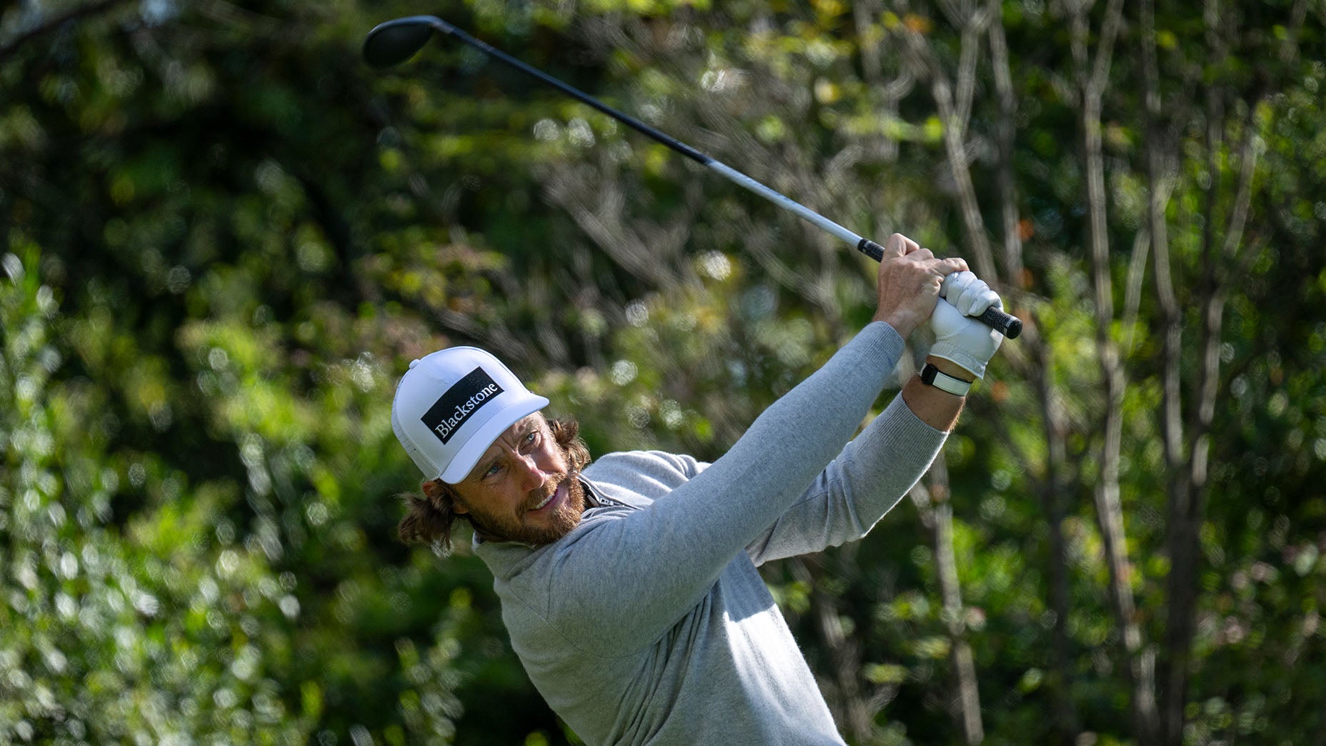 Tommy Fleetwood hits a tee shot at Augusta