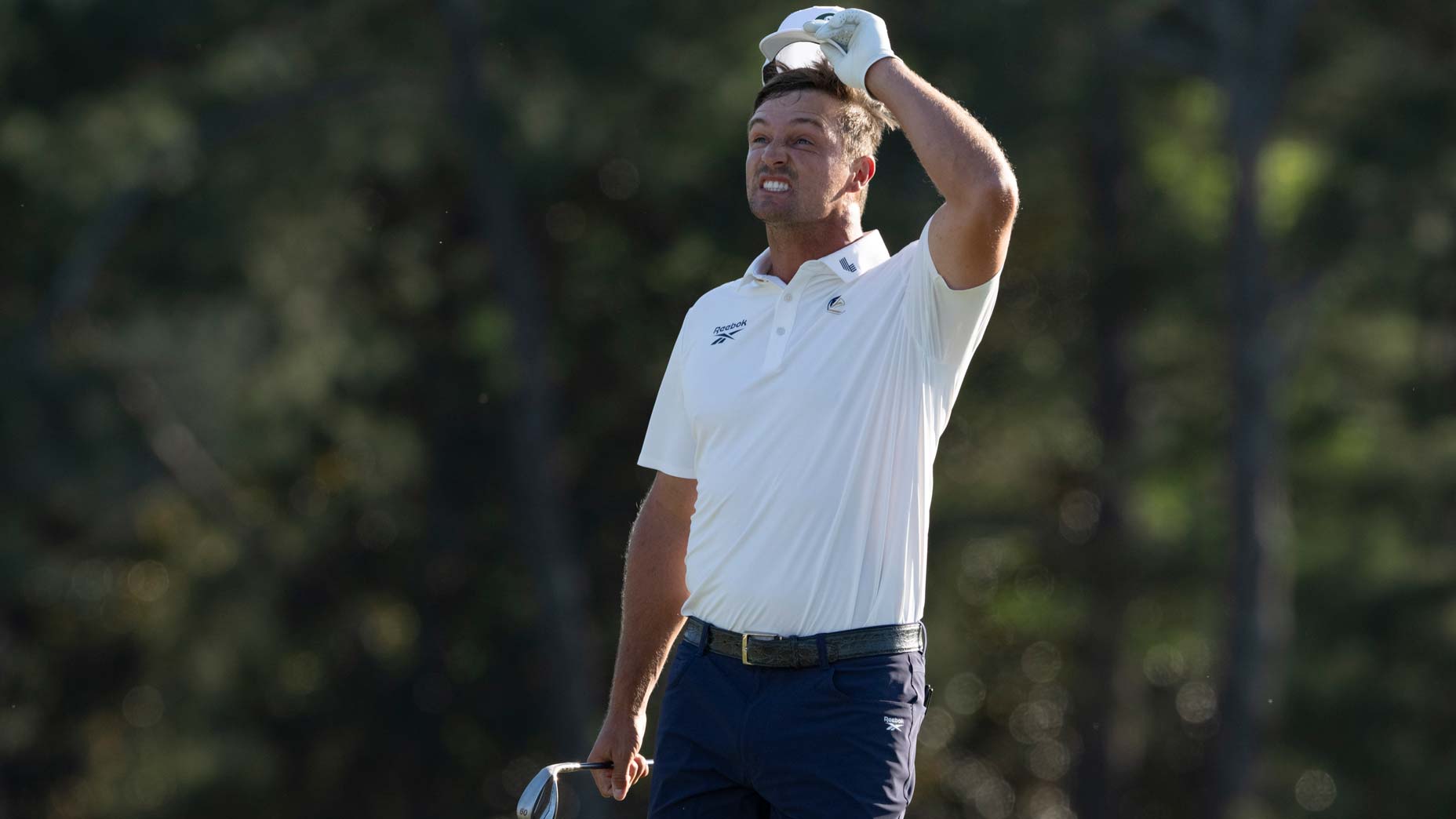 Bryson DeChambeau reacts on Augusta National's 18th green at the 2026 Masters after missing the cut.