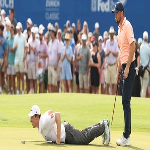 Matt and Alex Fitzpatrick read a putt during the Zurich Classic Saturday.
