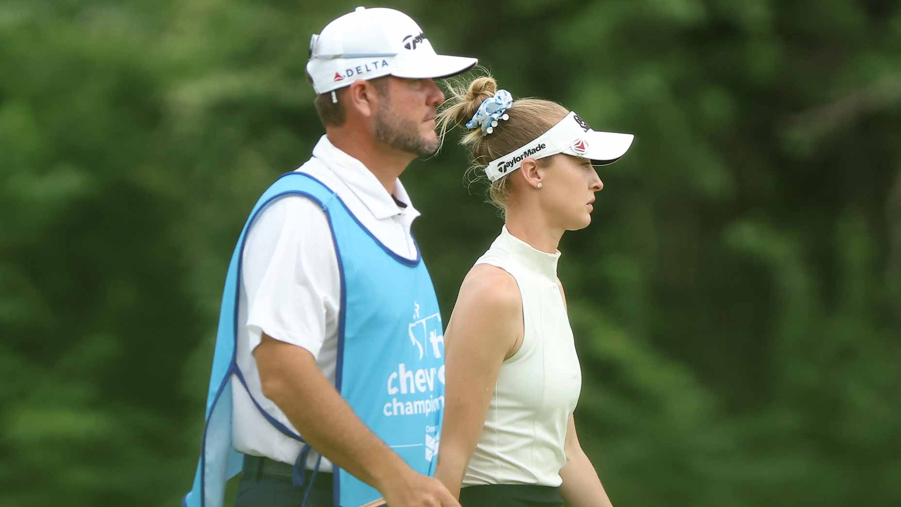 Nelly Korda walks with caddie during 2026 Chevron Championship at Memorial Park.