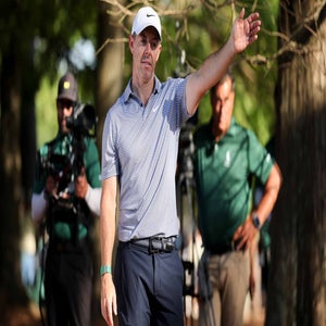 rory mcilroy points to the left during the 2026 masters tournament