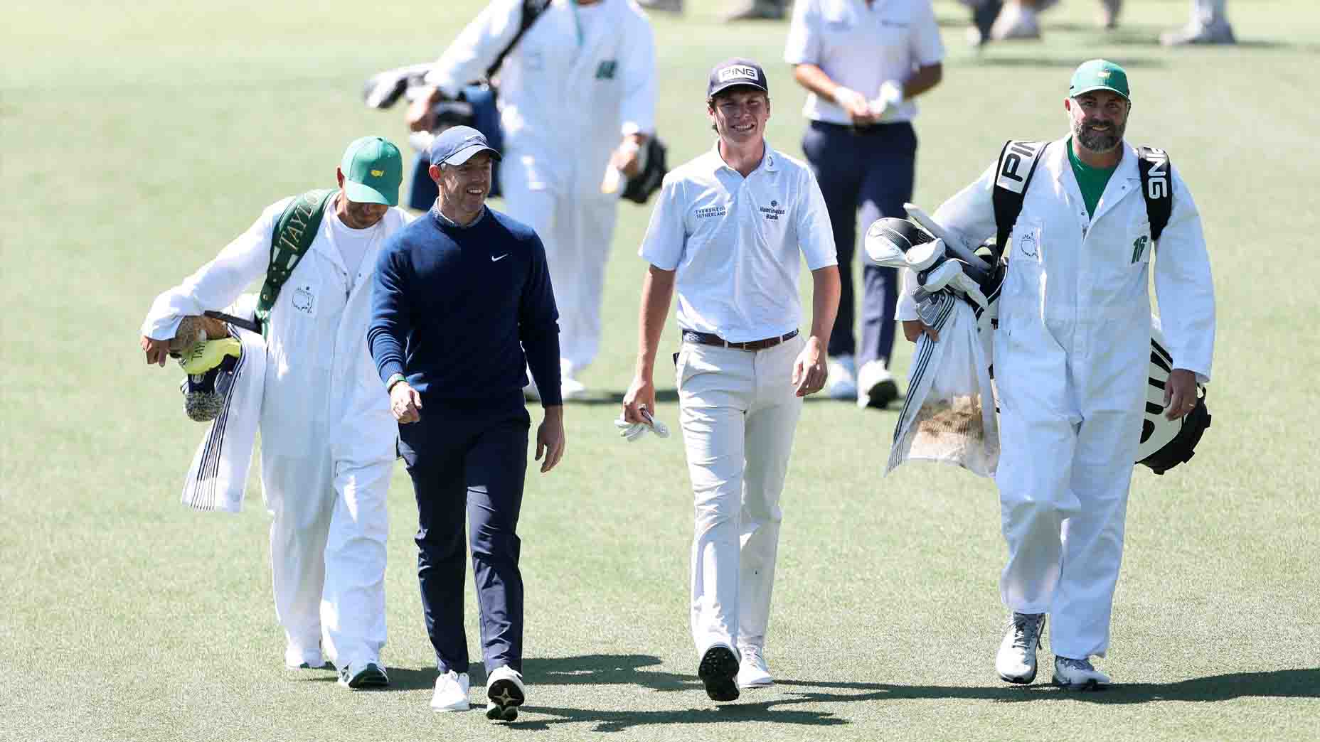 Rory McIlroy talks with Mason Howell at the Masters