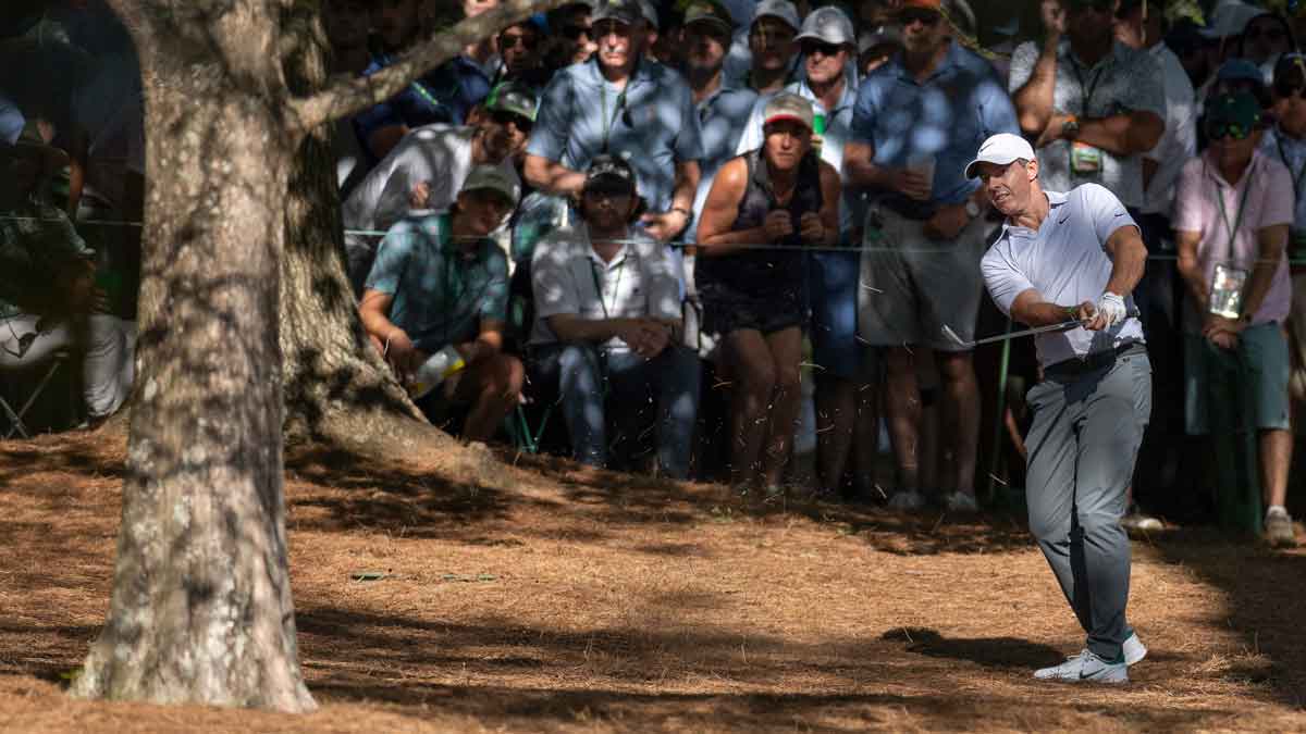 ory McIlroy of Northern Ireland hits a stroke from the pine straw at No. 13 during the second round of the Masters at Augusta National Golf Club, F