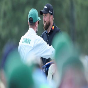 Shane Lowry talks with caddie during 2026 Masters Sunday at Augusta National.