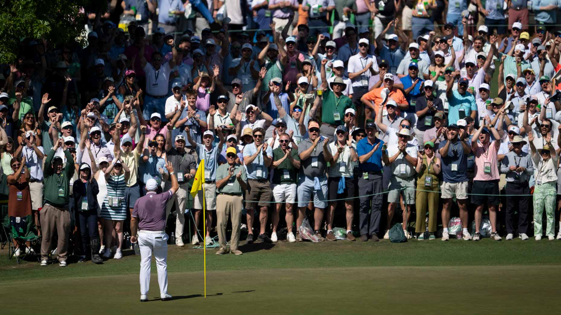 Shane Lowry waves to Masters patrons after a hole-in-one on No. 6 during the third round of the 2026 Masters at Augusta National.