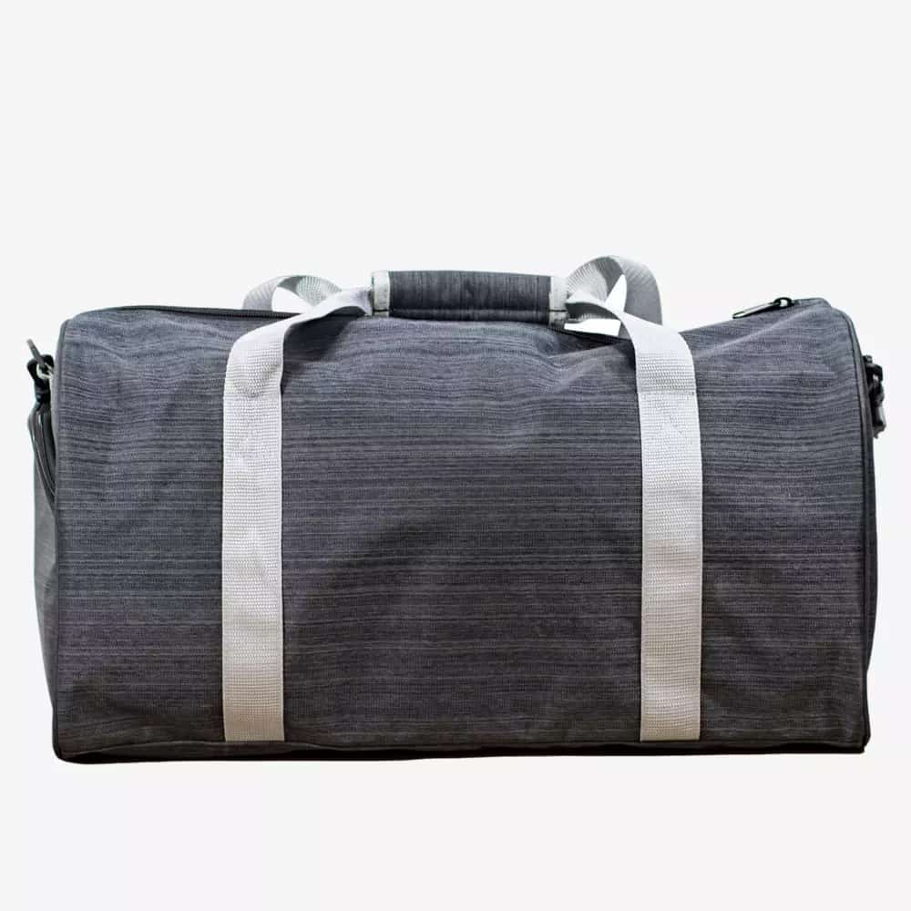 A gray duffel bag with white handles and a padded grip, photographed against a plain white background—perfect for carrying essentials like the best golf rangefinders to your next game.