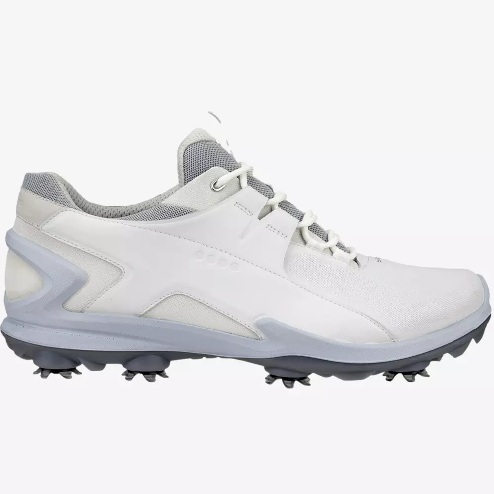 A white and light gray athletic golf shoe with a textured sole and cleats, shown from the side on a plain white background—perfect for those seeking the best golf deals for $100 or less.