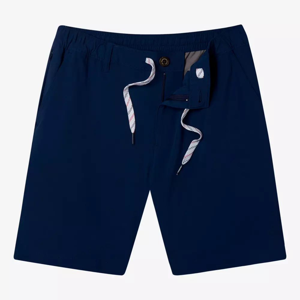 A pair of navy blue shorts with an elastic waistband, white drawstring, button closure, and side pockets—perfect for pairing with your best golf travel bags—displayed on a plain white background.
