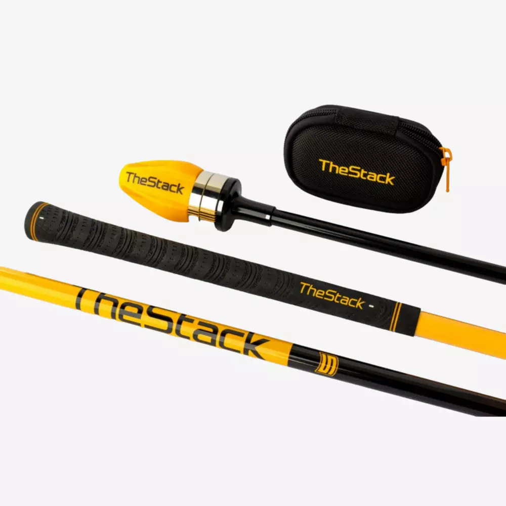 A yellow and black golf swing training aid labeled TheStack, shown disassembled with its parts and a small black carrying case featuring TheStack branding on a white background—perfect for those seeking the best deals under $50.