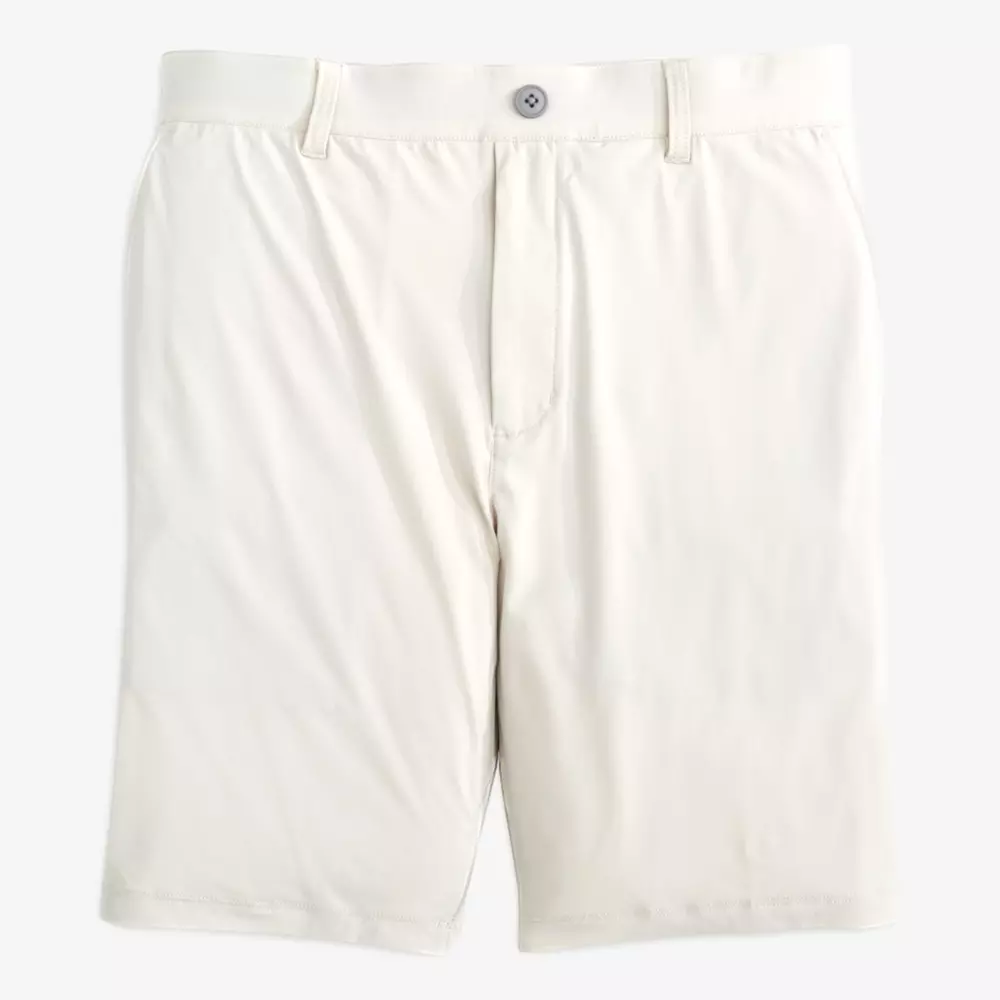 A pair of light beige shorts with belt loops, a button closure, and side pockets—perfect for pairing with the best golf travel bags—displayed on a white background.