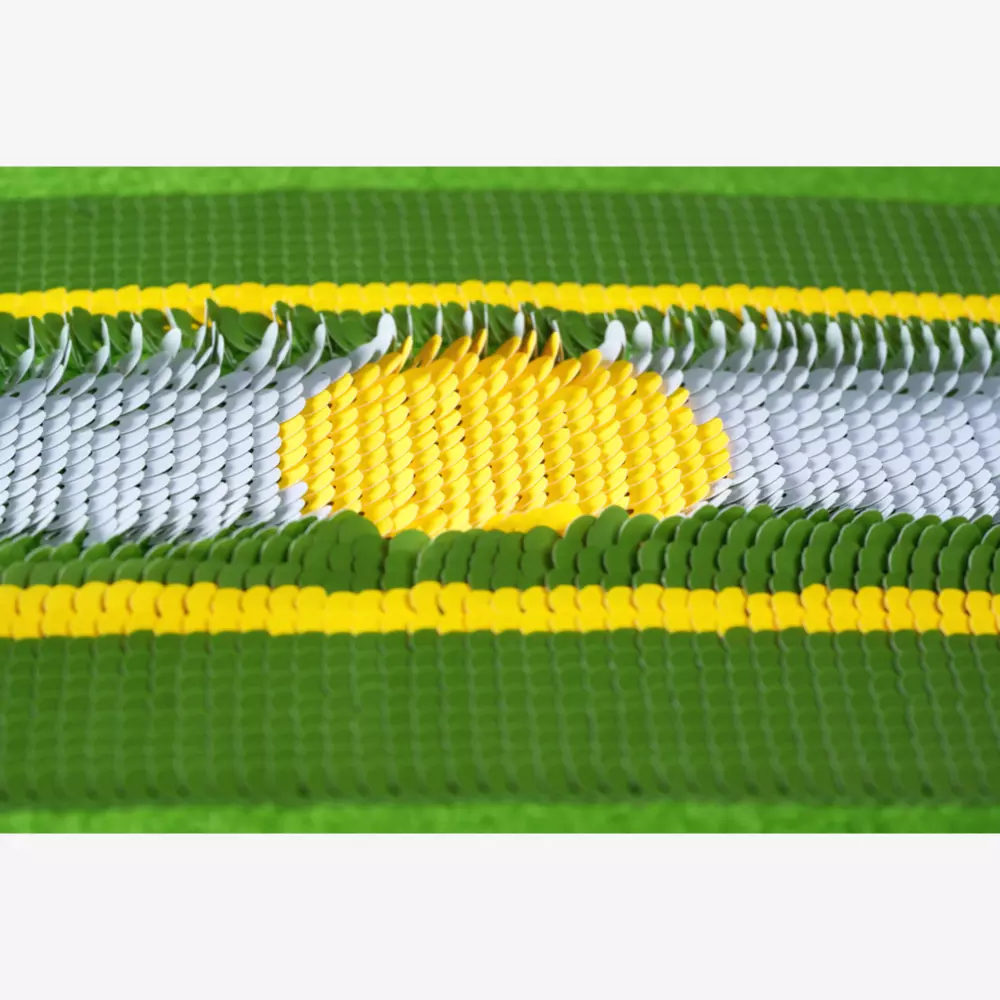Rows of small, round sequins form a green-edged pattern with a white center and a yellow sun or circle, bordered by yellow stripes. The shimmering surface offers eye-catching style—find best deals under $50 for this vibrant look.