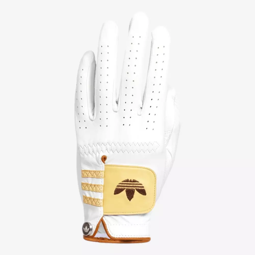 A white golf glove with perforations on the fingers, gold and beige accents, and an embroidered Adidas logo on the wrist strap—perfectly complementing your style alongside the best golf bags 2026—displayed palm down against a plain background.