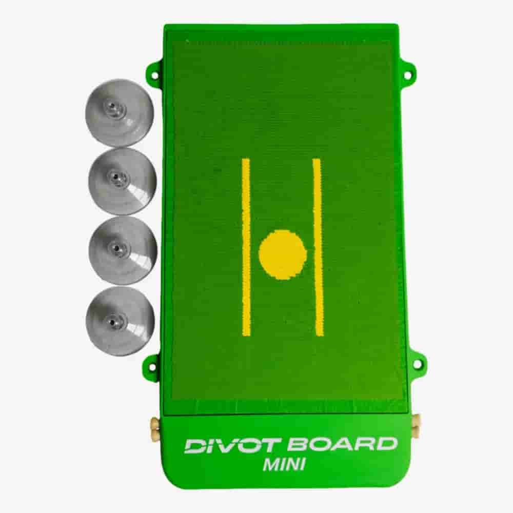 A green Divot Board Mini golf training aid with a yellow line and circle in the center, shown next to four suction cups on a white background—perfect for those seeking tools as innovative as the best golf bags 2026.