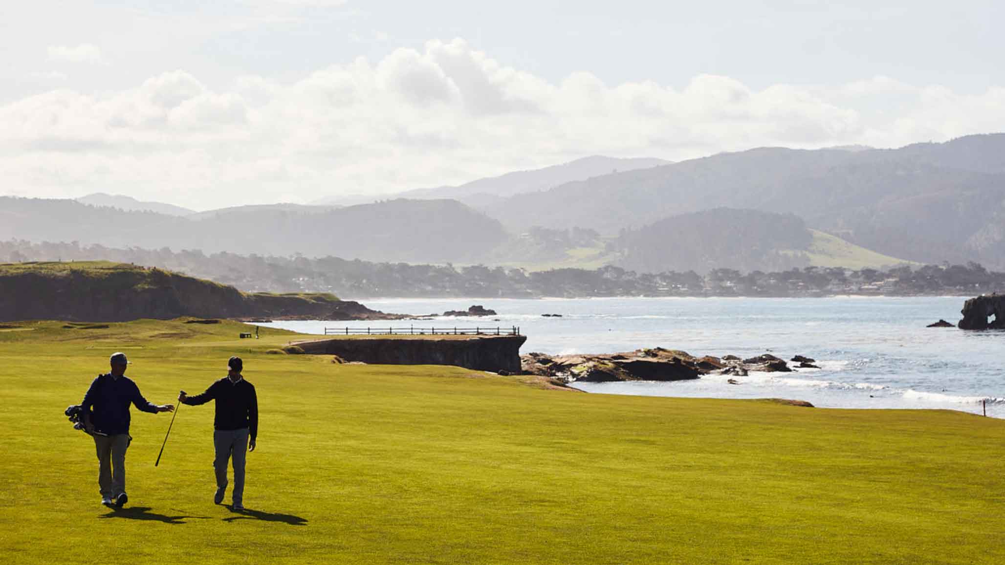 Caddy and golfer on 18th fairway Pebble Beach Caddies, US Open Preview Pebble Beach Golf Links, Pebble Beach, CA,