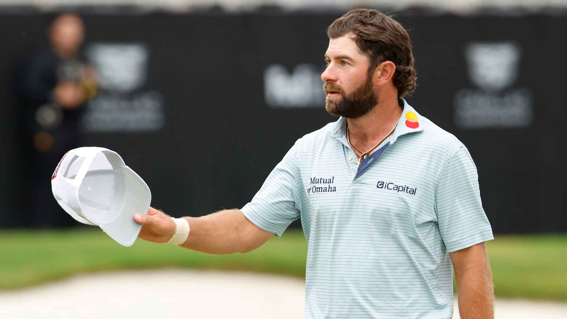 Cameron Young gestures to the crowd at the Cadillac Championship
