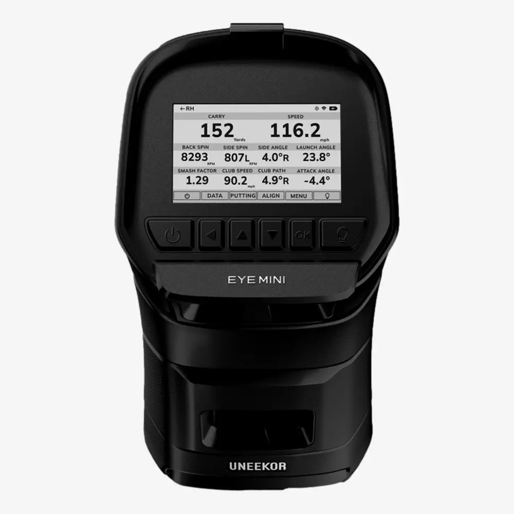 A black Uneekor EYE MINI golf launch monitor with a screen displaying golf shot metrics such as carry distance, speed, backspin, and launch angle&mdash;because is summer the right time to buy rain gear? Yes! Control buttons sit just below the screen.
