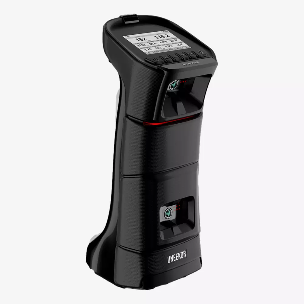 A black, handheld electronic device with a display screen on top showing numerical data, and labeled UNEekOR at the bottom. The device has buttons, sensors, and a textured grip&mdash;because is summer the right time to buy rain gear? Yes!.