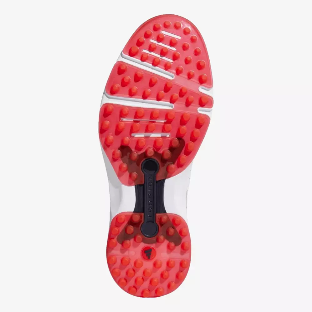 The image shows the sole of a shoe with a bright red, textured rubber surface featuring raised round studs for grip and white and black detailing across the middle—perfect for those seeking the best golf deals for around $250.