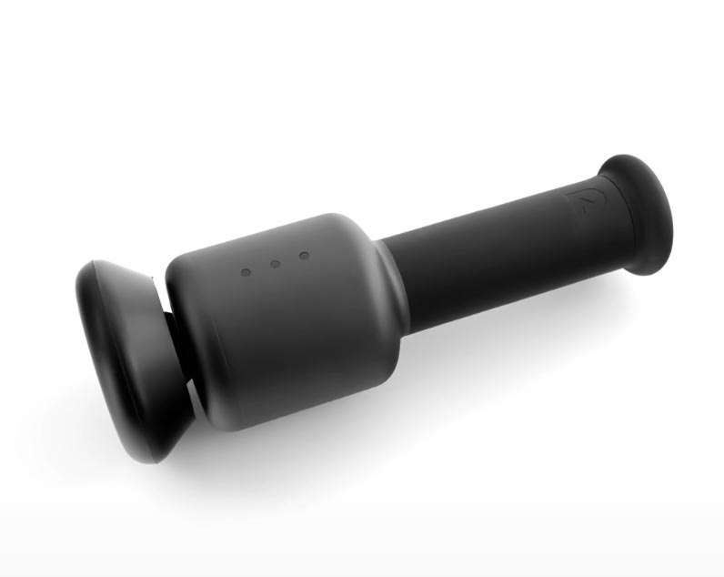 A sleek, black handheld portable massage device with a cylindrical handle and two flat, rounded ends lies on a white background. Three small indicator lights are visible on the side—an ideal choice for Father's Day gifts.