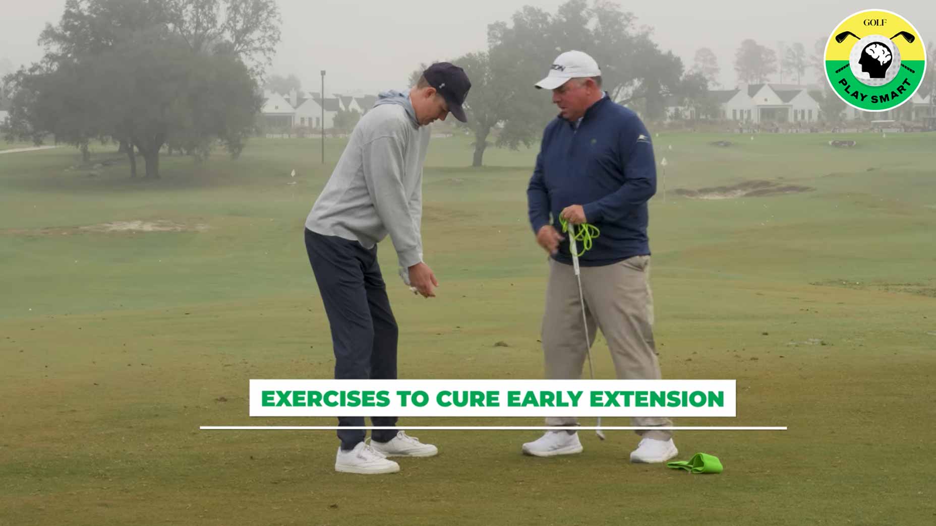 GOLF Top 100 Teacher Tony Ruggiero stands next to GOLF.com game-improvement editor zephyr melton on a driving range