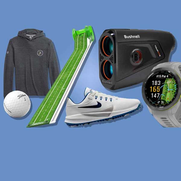 A gray hoodie, a golf ball, a green putting mat, a white Nike golf shoe, a black Bushnell rangefinder, and a smartwatch with a golf display&mdash;all essential golf equipment&mdash;are neatly arranged on a blue background.