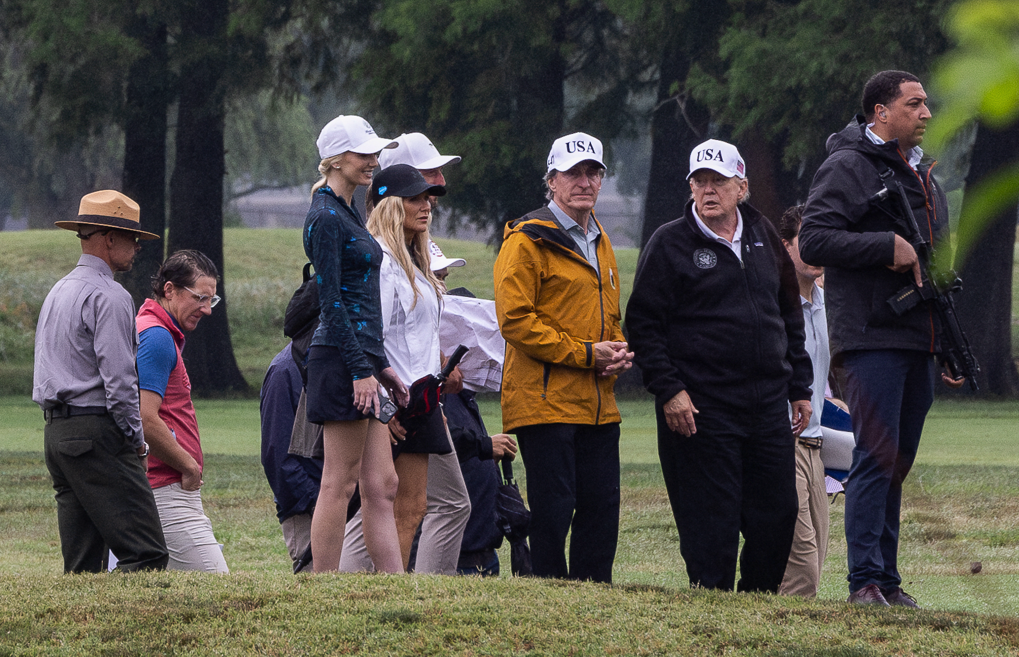 Doug Burgum, US secretary of the interior, center, and US President Donald Trump, second right, at East Potomac Golf Links in Washington, DC, US, on Sunday,