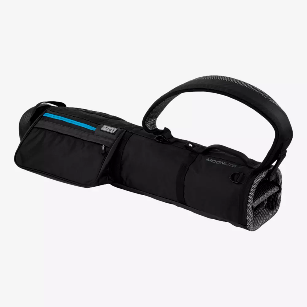 A black duffel-style bag with a large handle, zippered compartments, a small blue accent, and mesh side panel, displayed on a plain light background.