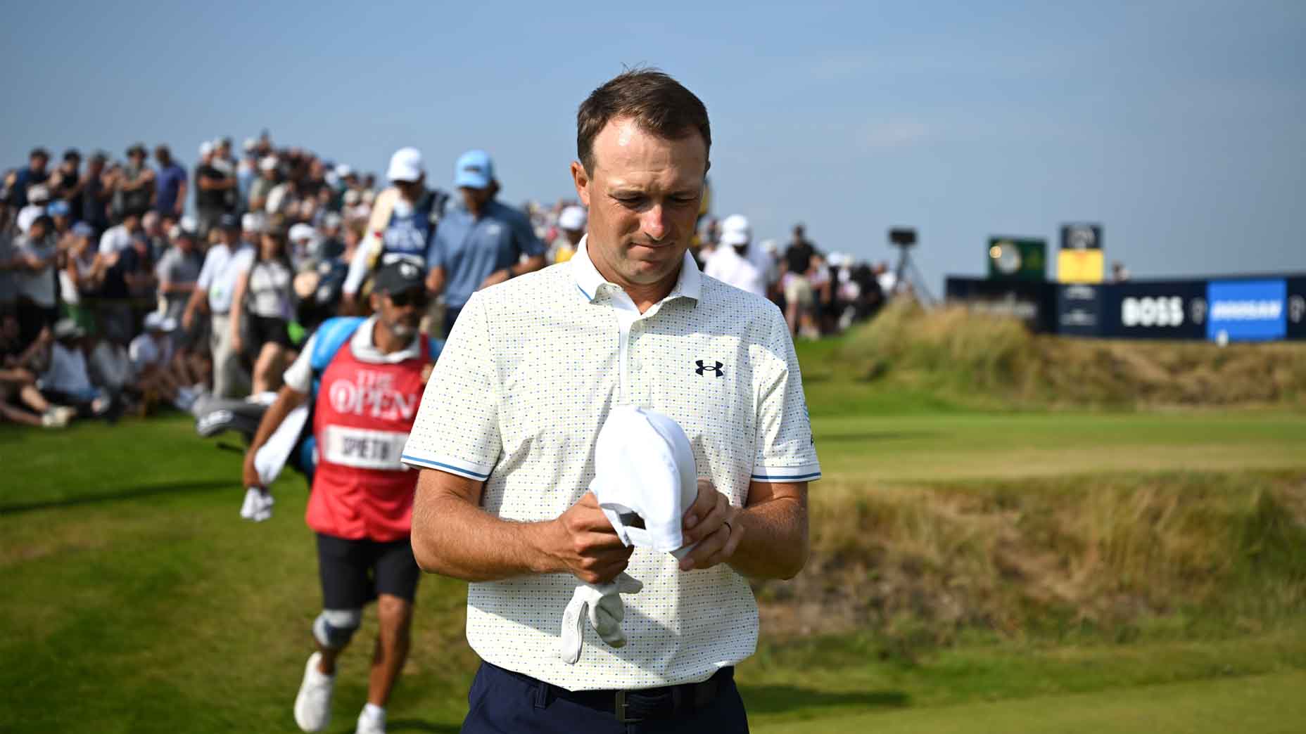 Jordan Spieth walks with his hat off during the second round of the Open Championship