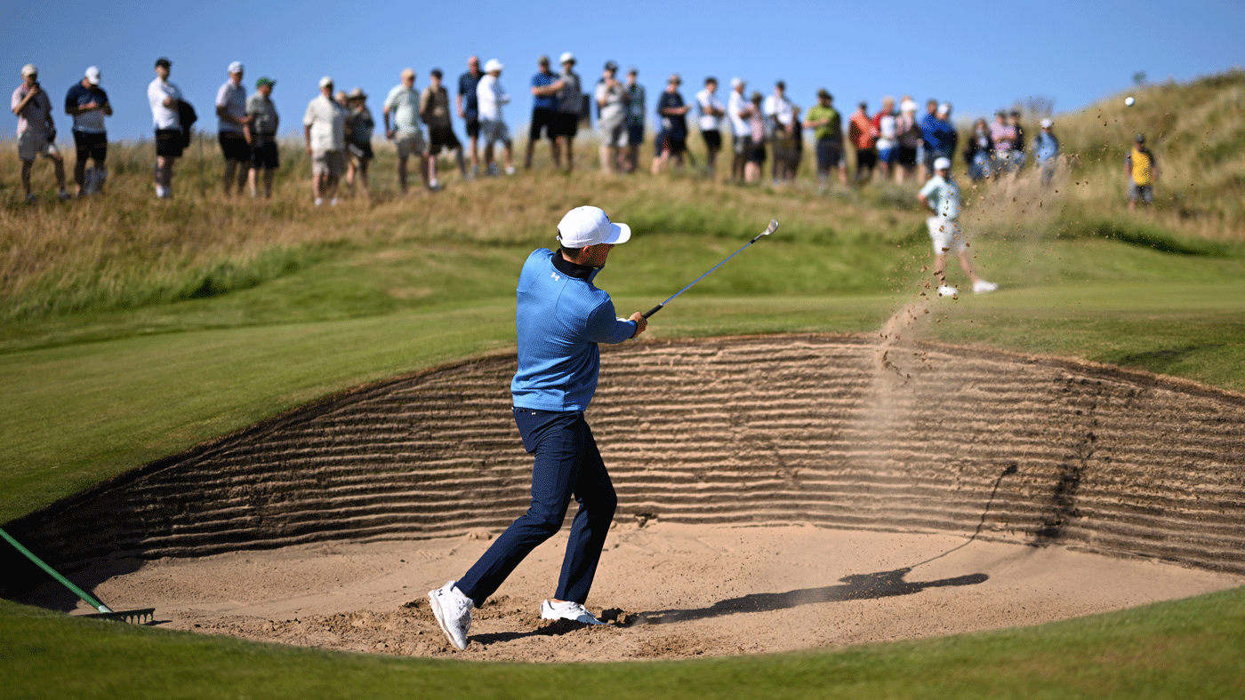 Jordan Spieth of the United States plays out of a bunker on the 11th hole during a practice round, prior to The 154th Open Championship at Royal Birkdale