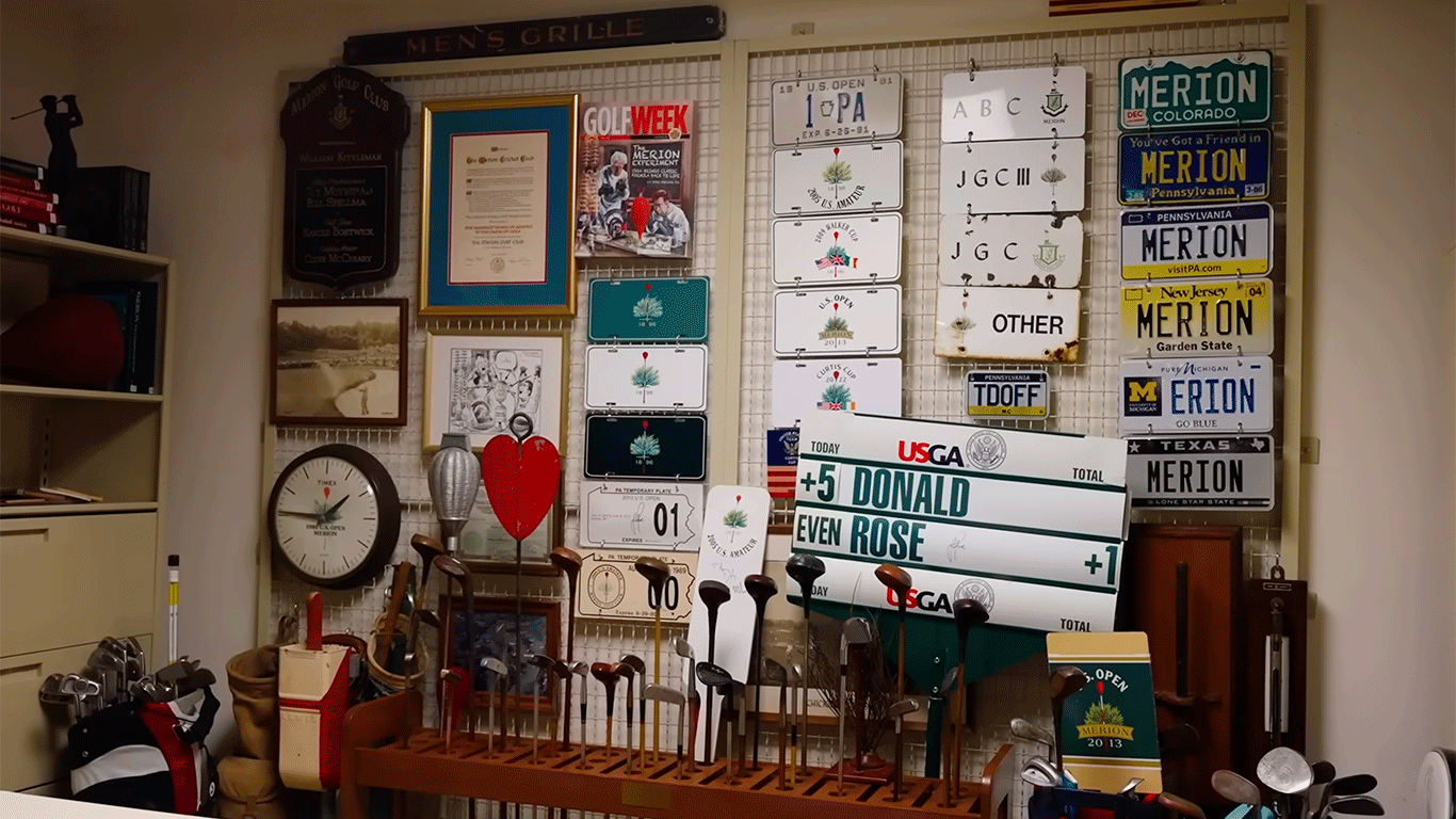 A wall covered with golf memorabilia in merion's archives room